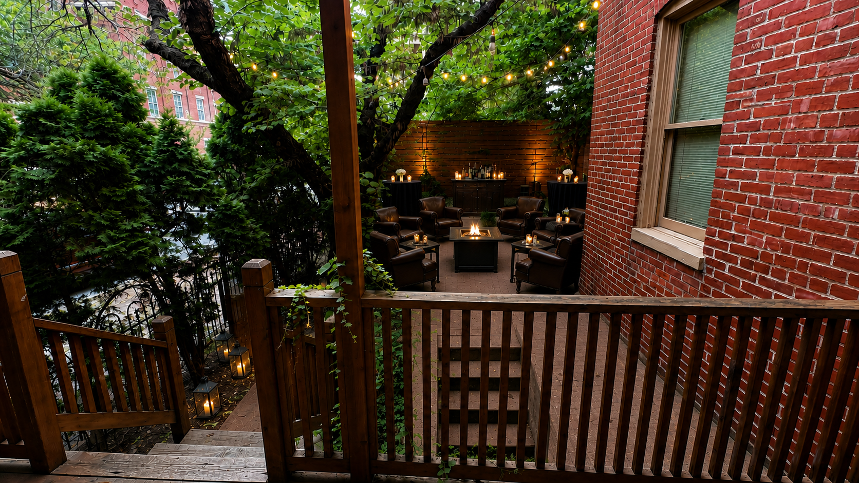 Patio lounge with leather chairs gathered around a fire pit